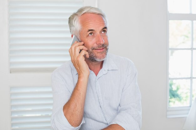 Mature man using mobile phone