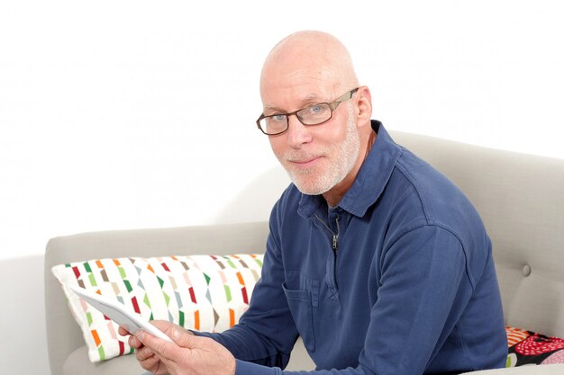 Mature man using a tablet