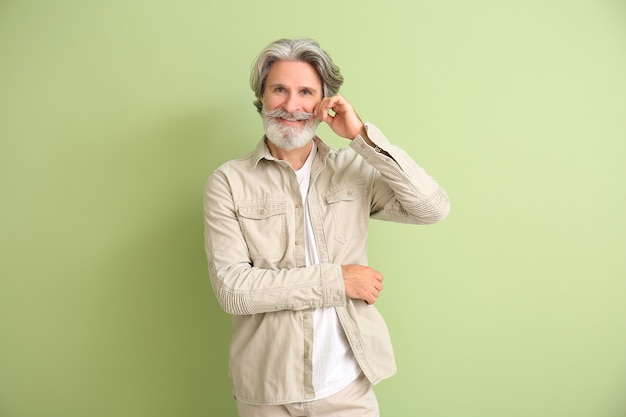 Mature man with grey hair on color