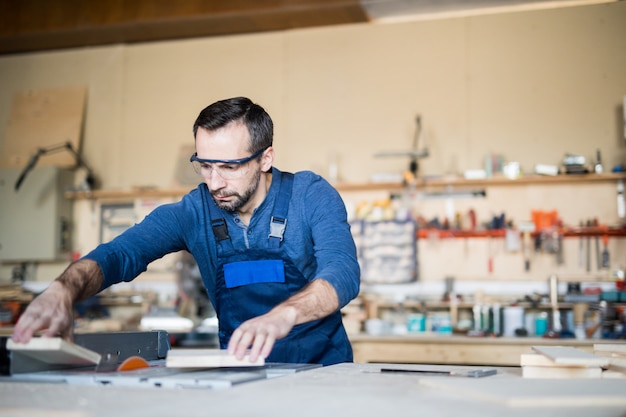 Mature Man Working with Wood