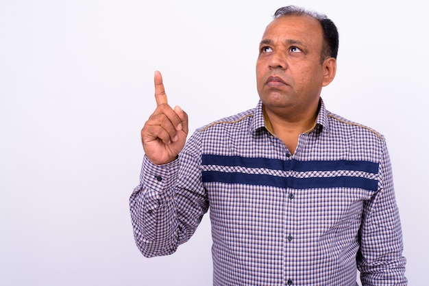 mature overweight Indian businessman with receding hairline on white