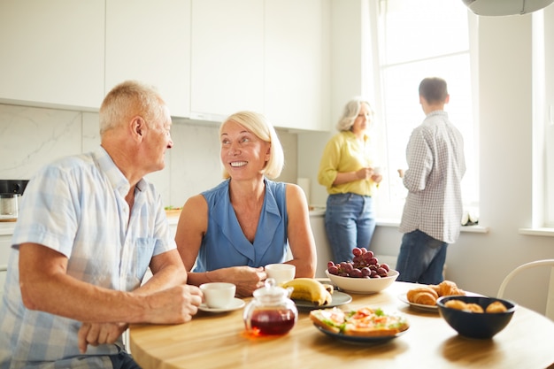 Mature People Drinking Tea in Kitchen