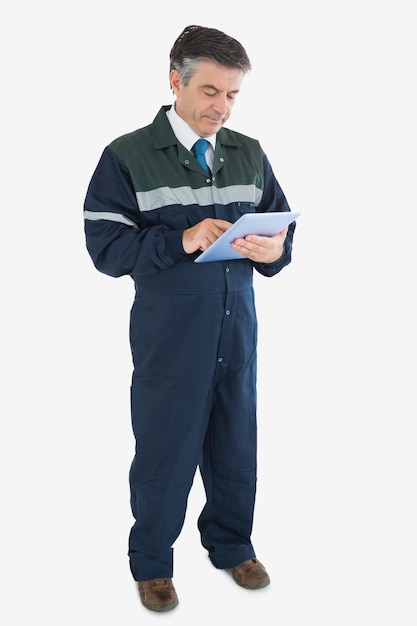 Mature repairman using digital tablet