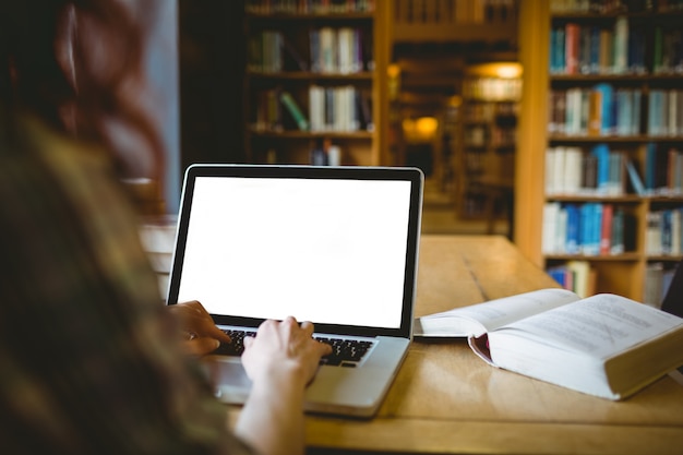 Mature student studying in library