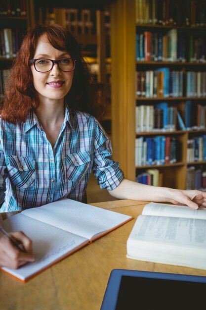 Mature student studying in library