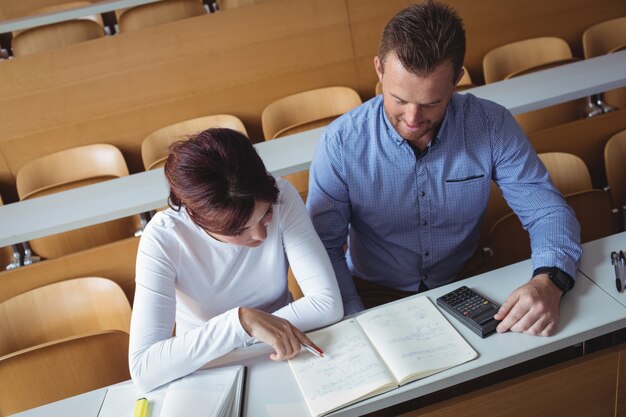 Mature students reading a book