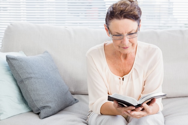 Mature woman reading book