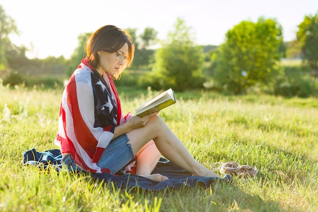 Mature woman reads a book