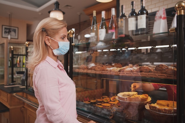 Mature woman shopping at the bakery