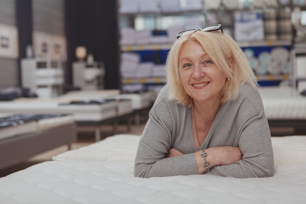 Mature woman shopping at the furniture store