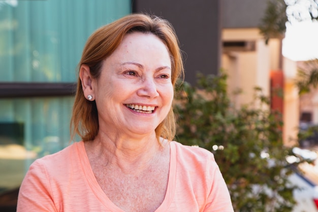 Mature woman smiling looking at camera. elderly woman smiling