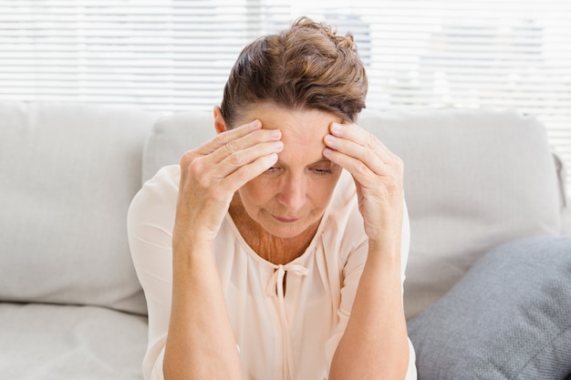 Mature woman suffering from headache