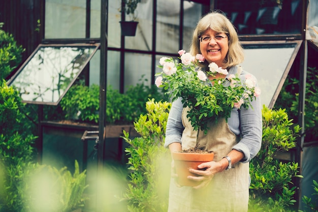 Mature woman tending to her plants