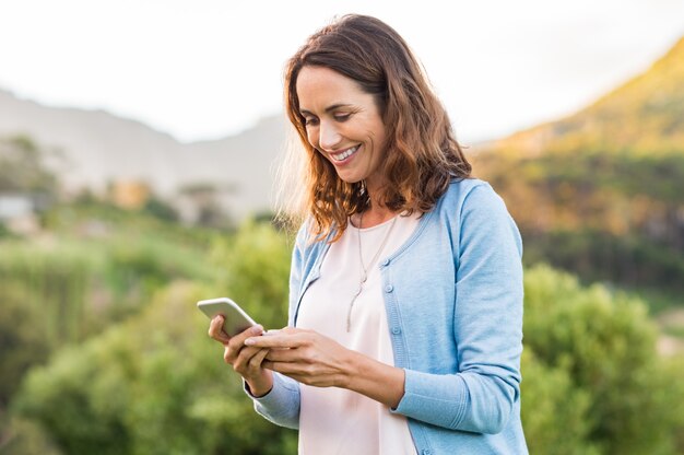 Mature woman using cellphone