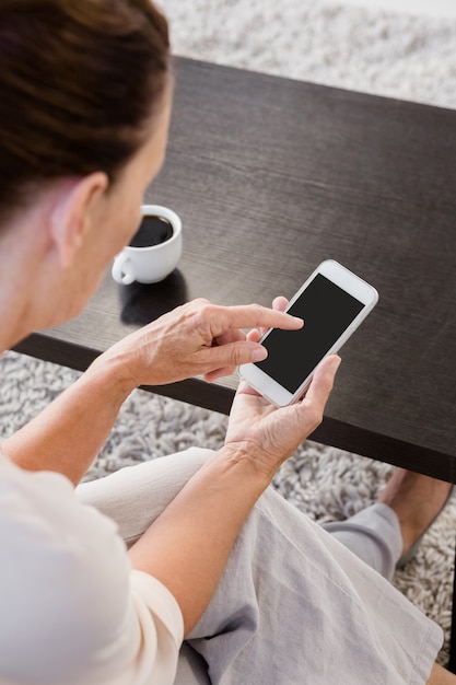 Mature woman using smartphone