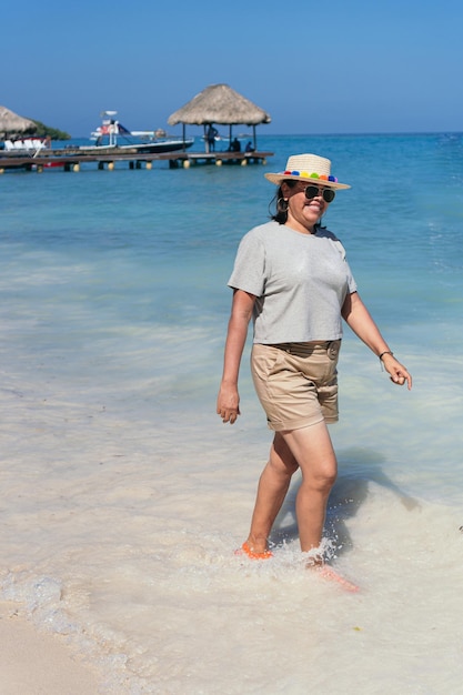 Mature woman walking on beach