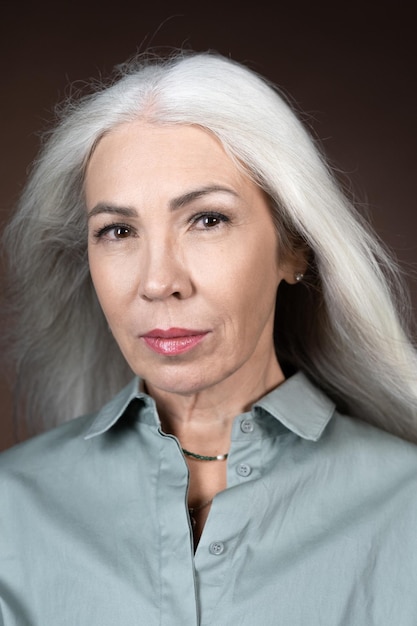 Mature woman with long grey hair