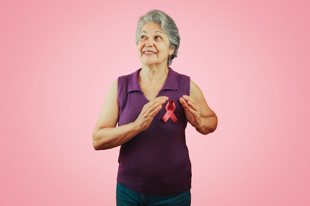 Mature Woman With Pink Ribbon isolated for breast cancer campaign