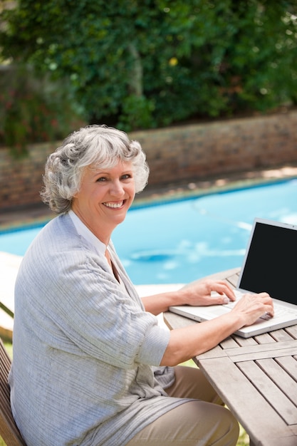 Mature woman working on her laptop