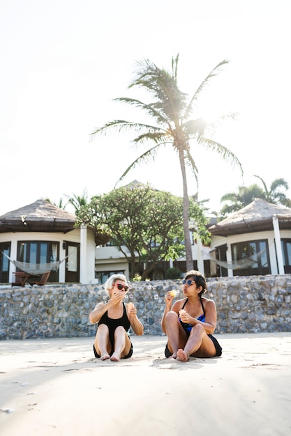 Mature women tanning on the beach