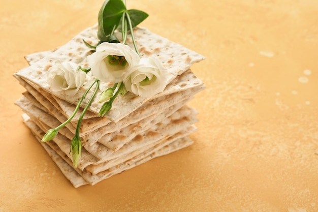 Matzah Passover celebration concept Traditional ritual Jewish bread on sand color old wall background Passover food Pesach Jewish holiday of Passover celebration concept Passover food