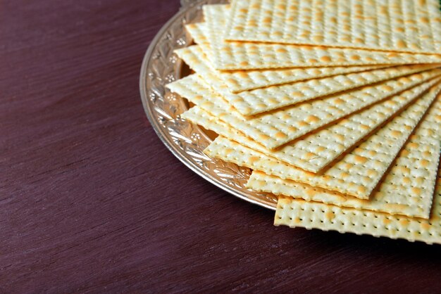 Matzo for Passover on metal tray on table close up