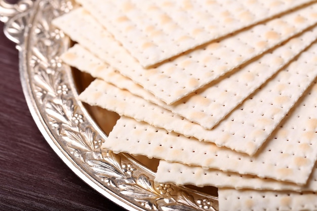 Matzo for Passover on metal tray on table close up