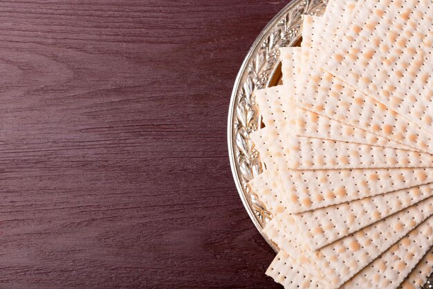 Matzo for Passover on metal tray on table close up