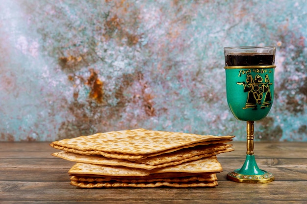 Matzos bread with kiddush cup of wine Jewish pesah holiday.
