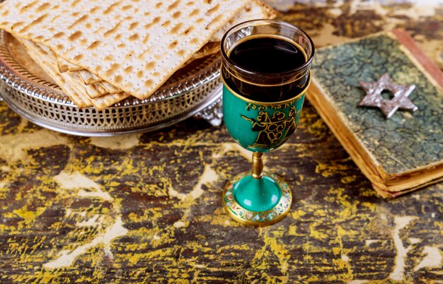 Matzot and glasses of red wine symbols of Passover