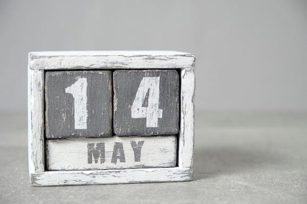 May 14 calendar made wooden cubes gray backgroundWith an empty space for your text