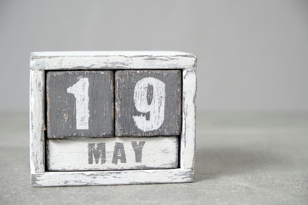 May 19 calendar made wooden cubes gray backgroundWith an empty space for your text