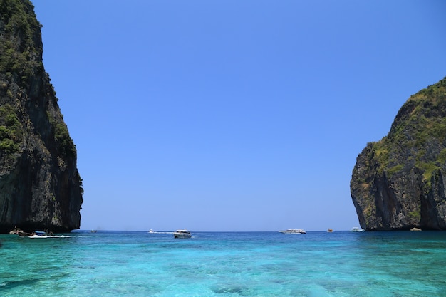 Maya Bay lagoon with Motor boat on turquoise water