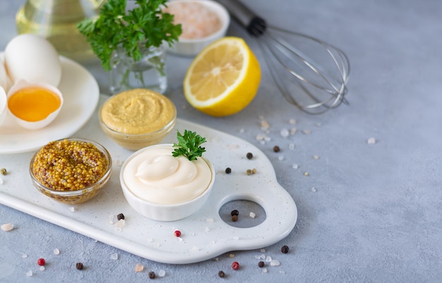 Mayonnaise ingredients gray stone background