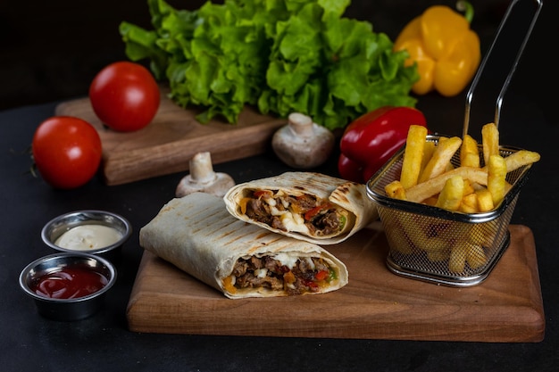 A meal from the restaurant is served on a cutting board.