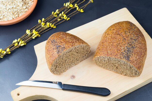 Meal organic wholemeal bread with oats and wheat in the dining room