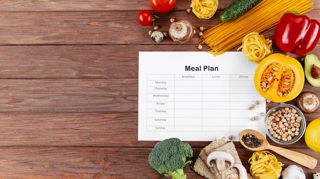 Meal plan with copy space and lots of vegetables and pasta