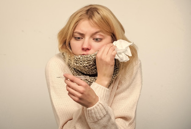 Measure temperature break fever remedies seasonal flu concept\
woman feels badly how to bring fever down fever symptoms and causes\
sick girl with fever girl sick hold thermometer and tissue