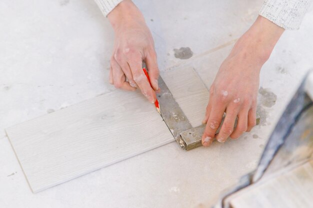 Measure tile repair in the house Selective focus