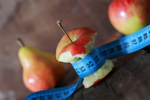 Measurement red bitten apple