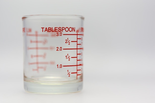 Measuring cup, measuring cup, ounces on a white\
background.