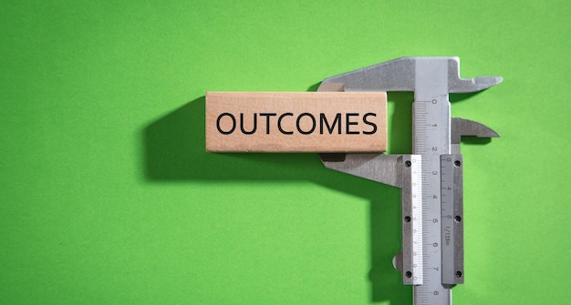 Measuring Outcomes word Business concept