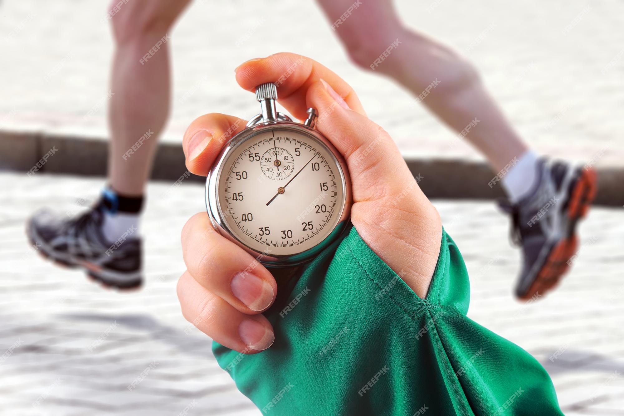 Measuring the Running Speed of an Athlete Using a Mechanical Stopwatch.  Hand with a Stopwatch on the Background of the Legs of a Stock Image -  Image of chronometer, monitor: 257808953