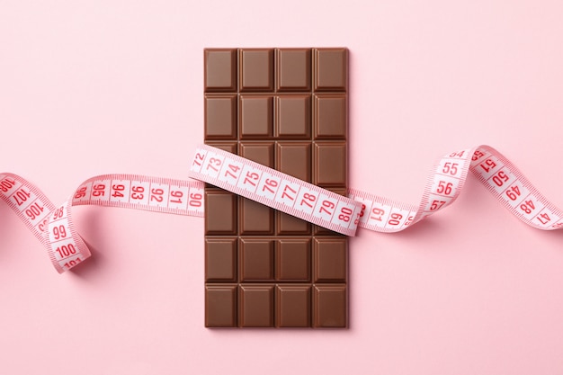 Measuring tape and chocolate bar