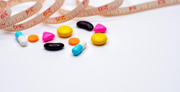 Measuring tape and pills for dieting concept medical health care and prevention