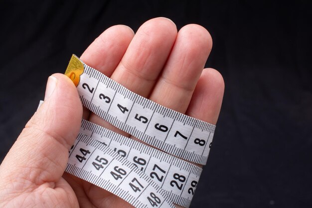 Measuring tape for tool roulette or ruler in hand