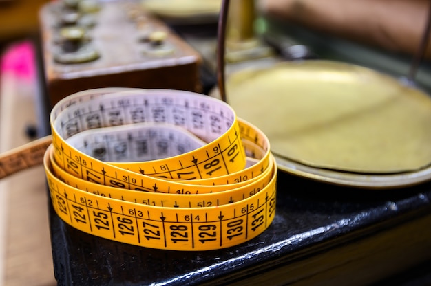 Measuring tapes in a sewing workshop. Rome, Italy