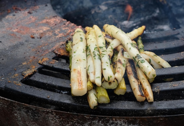 Meat and asparagus on the bbq in the summer