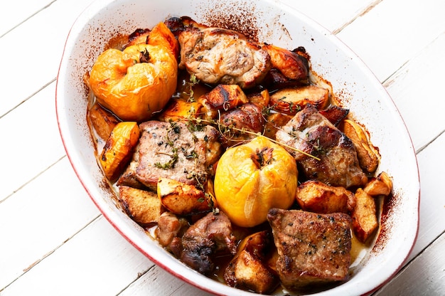 Meat baked with apples and quince