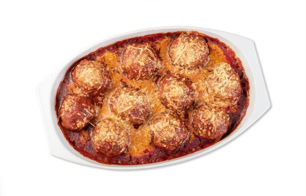 Meat balls on a white plate with tomato sauce and melted cheese isolated over white background